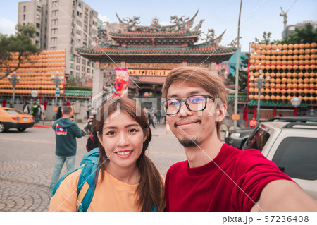 Asian man and woman traveler with backpack 57236408