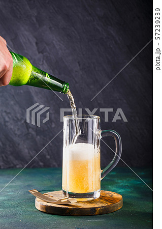 Mug of beer on dark background Mug of beer on dark background 57239239