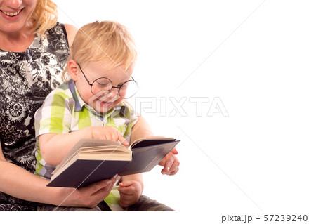 Cute happy kid reading a book Cute happy kid reading a book 57239240