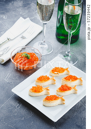 Delicious appetizer with red caviar. Delicious appetizer with red caviar. 57239442