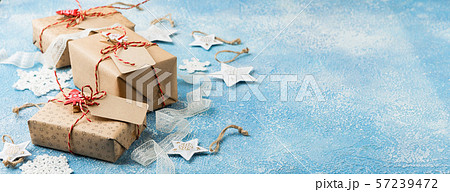 Gift box with stars and crocheted snowflakes Gift box with stars and crocheted snowflakes 57239472