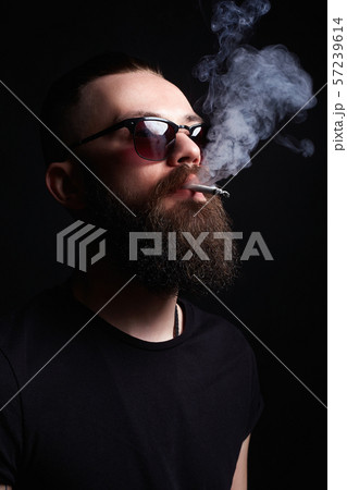 handsome smoking man. boy in sunglasses 57239614