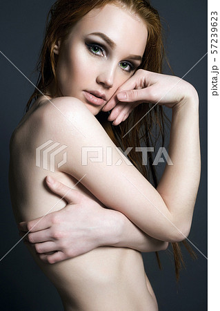 写真素材: Young wet woman. Naked Beautiful Girl