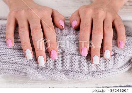 Manicure on knitted background. Manicure on knitted background. 57241004