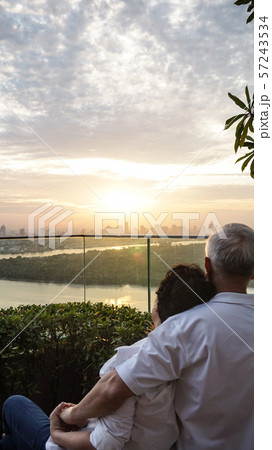 Asian senior couple with morning sunrise on luxury Asian senior couple with morning sunrise on luxury 57243534