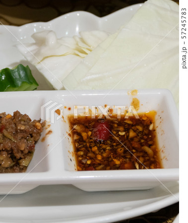 Burmese fermented dipping sauces in dip bowls 57245783
