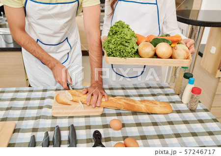 Couple cutting dish ingredients Couple cutting dish ingredients 57246717