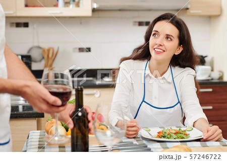 Pretty woman eating at home 57246722
