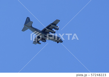 grey military transport plane fly on blue sky 57248223