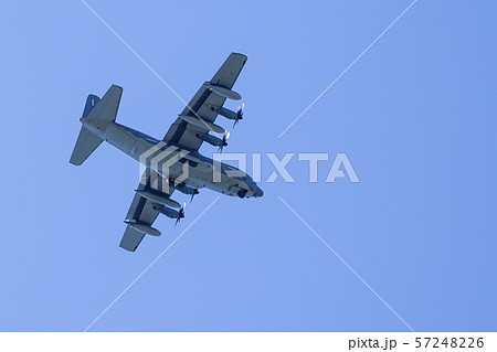 grey military transport plane fly on blue sky grey military transport plane fly on blue sky 57248226