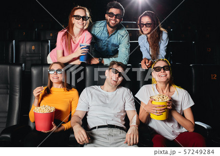pleasant company enjoying day off at the cinema 57249284