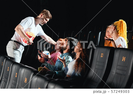 drunk man holding popcorn and flirting with ginger girl drunk man holding popcorn and flirting with ginger girl 57249303