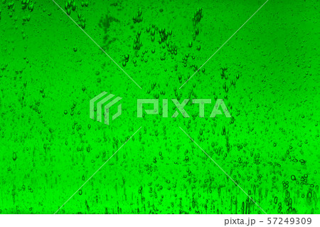 Floating bubbles in green liquid background texture. 57249309
