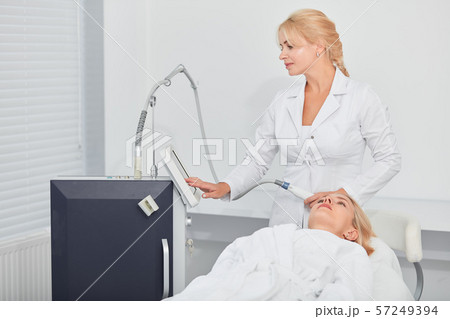 attractive nurse preparing tool fo cleaning the patient's face 57249394