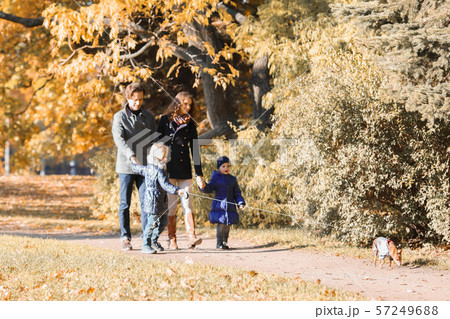 Family walk in autumn park Family walk in autumn park 57249688