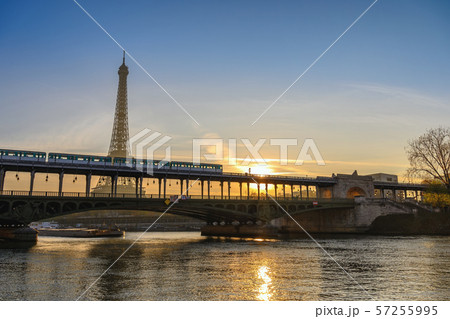 Paris France city skyline sunrise at Eiffel Tower and Seine River with Pont de Bir-Hakeim bridge and Paris Metro 57255995