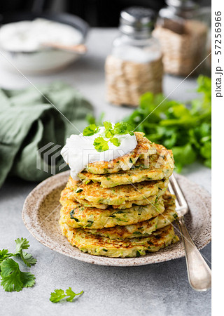 Zucchini quinoa fritters with sour cream Zucchini quinoa fritters with sour cream 57256966