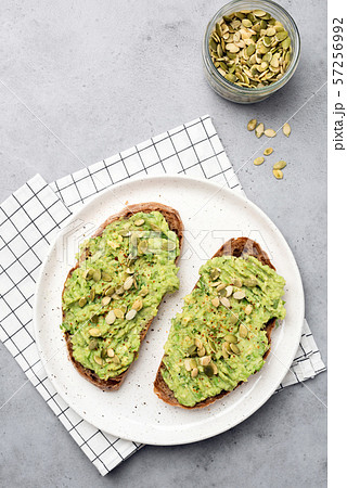 Healthy rye bread avocado toast with seeds 57256992