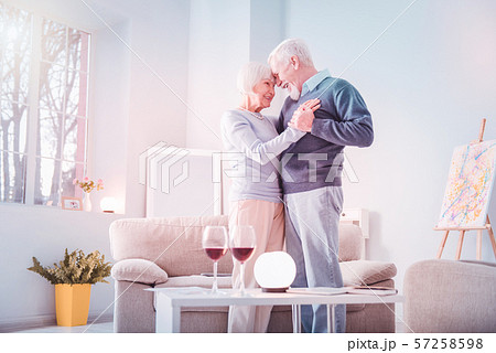 Couple of retired man and woman having extremely romantic date at home Couple of retired man and woman having extremely romantic date at home 57258598
