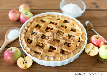 close up of apple pie on wooden table close up of apple pie on wooden table 57259378