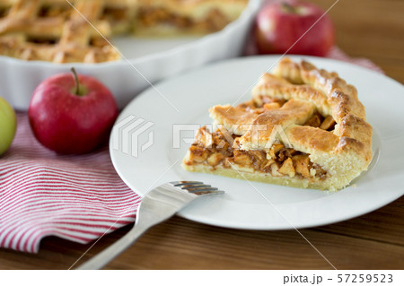 close up of apple pie and fork on plate 57259523