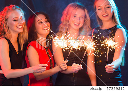 Party, holidays, nightlife and new year concept - happy young women dancing at night club disco Party, holidays, nightlife and new year concept - happy young women dancing at night club disco 57259812