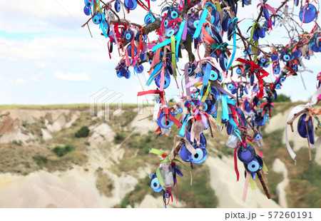 Evil eye charms hang from a tree in Cappadocia, Evil eye charms hang from a tree in Cappadocia, 57260191
