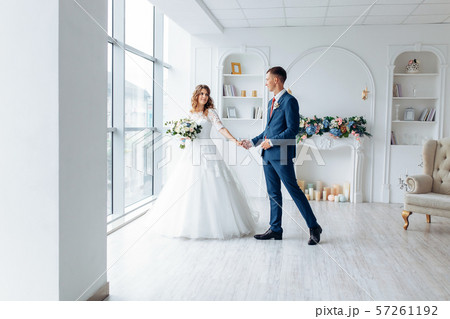 Beautiful bride in white dress and groom in suit, Beautiful bride in white dress and groom in suit, 57261192