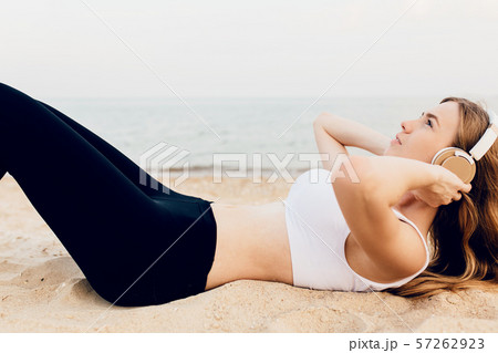 sporty girl doing exercises on the belly press, 57262923