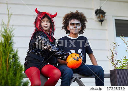 Happy Kids Looking at Camera on Halloween Happy Kids Looking at Camera on Halloween 57263539