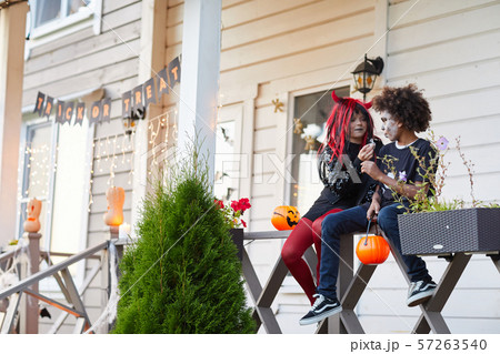 Kids eating Candy on Halloween 57263540