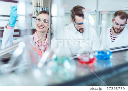 Three analytical chemists doing research in the lab 57263779