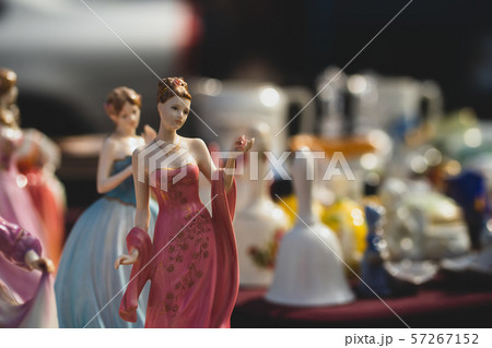 Porcelain figurines at the fair. Porcelain figurines at the fair. 57267152