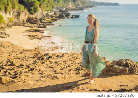Young woman tourist on Pantai Tegal Wangi Beach, Bali Island, Indonesia. Bali Travel Concept 57267336