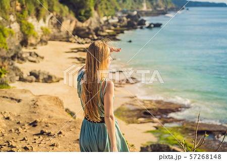 Young woman tourist on Pantai Tegal Wangi Beach, Bali Island, Indonesia. Bali Travel Concept 57268148