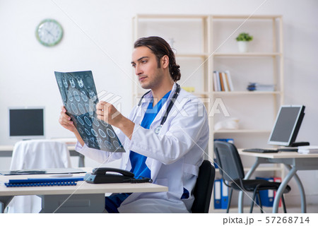 Young male doctor working in the clinic 57268714