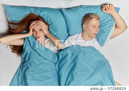 sick young woman has headache at night, health problem. close up top view photo. 57268829