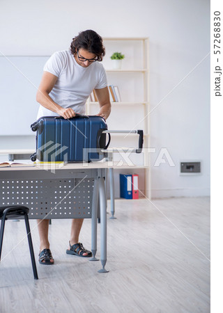 Young male student in front of whiteboard Young male student in front of whiteboard 57268830
