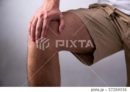 Young man suffering from leg pain Young man suffering from leg pain 57269336