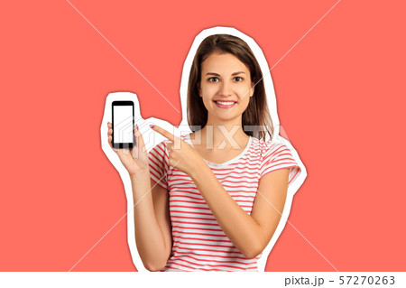 Happy beautiful young woman with long hair holding Happy beautiful young woman with long hair holding 57270263