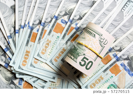 Top view of 50 rolled dollar bills on background 57270515