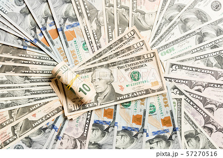 Close up of 10 dollar bills pile on background Close up of 10 dollar bills pile on background 57270516