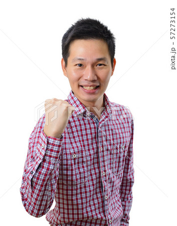 Happy excited young Asian man raising his fists doing yes gesture celebrating success 57273154
