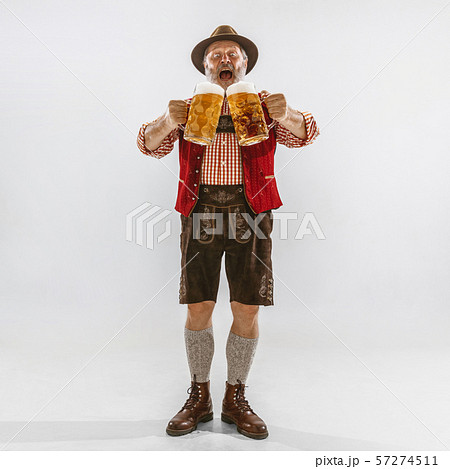 Portrait of Oktoberfest man, wearing the traditional Bavarian clothes Portrait of Oktoberfest man, wearing the traditional Bavarian clothes 57274511