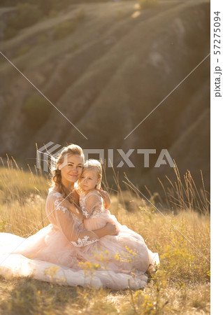 Young mother with a little daughter in pink 57275094