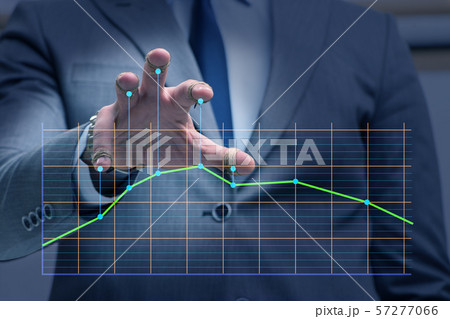 Businessman controlling the market with strings 57277066