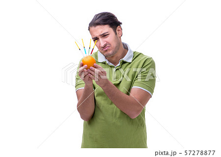 Young man in GMO fruits and vegetables concept 57278877
