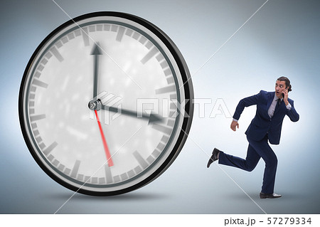 Businessman employee in time management concept 57279334