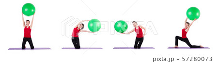 Young woman exercising with swiss ball Young woman exercising with swiss ball 57280073