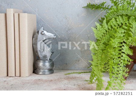 Antique book end on concrete background Antique book end on concrete background 57282251